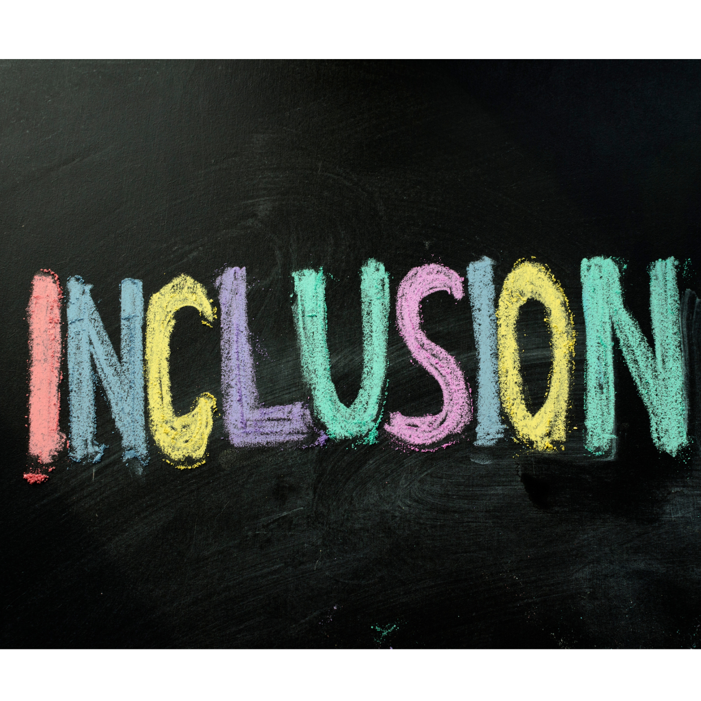 The word 'inclusion' written in coloured chalk on a blackboard